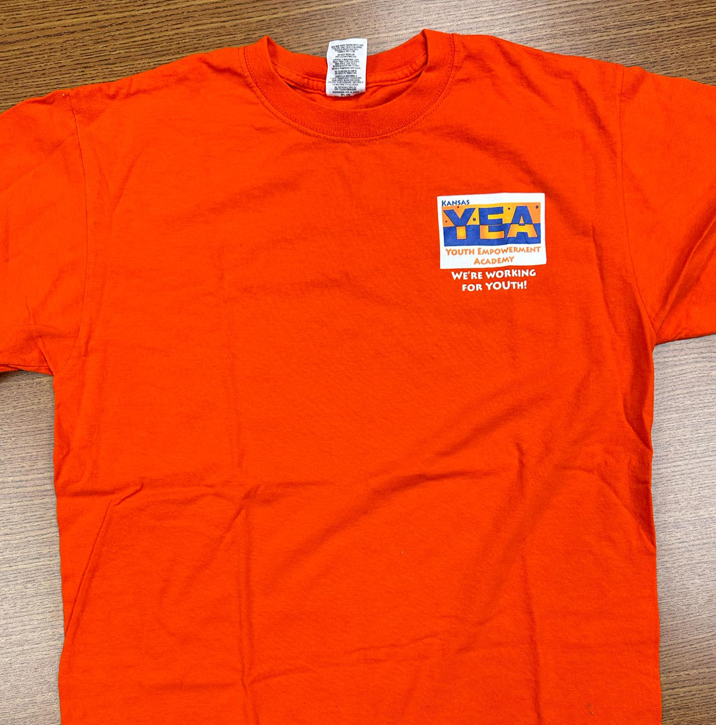 Front of KYEA Orange shirt- full description below photo